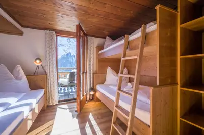 Ein Bett oder Betten in einem Zimmer der Unterkunft Berg'k'hof Kaisertal - Alpine Hideaway