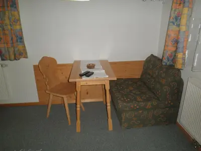 Ein Sitzbereich in der Unterkunft Hagauhof