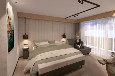 Ein Bett oder Betten in einem Zimmer der Unterkunft Hotel Almrausch