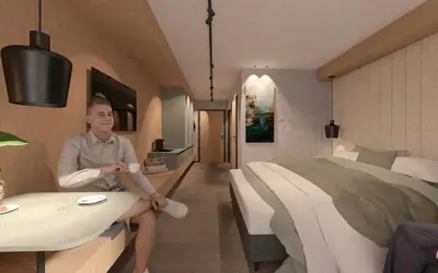 Ein Bett oder Betten in einem Zimmer der Unterkunft Hotel Almrausch