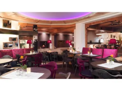 Ein Restaurant oder anderes Speiselokal in der Unterkunft Boutique Appartments Gerlosperle