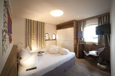 Ein Bett oder Betten in einem Zimmer der Unterkunft Boutique Appartments Gerlosperle