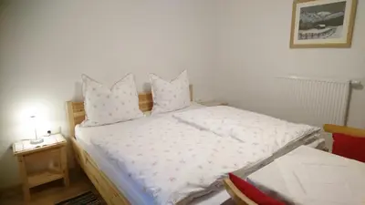Ein Bett oder Betten in einem Zimmer der Unterkunft Ferienwohnung Höllwarth