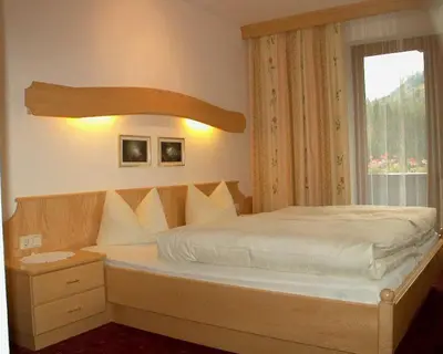 Ein Bett oder Betten in einem Zimmer der Unterkunft Gästehaus Elfriede