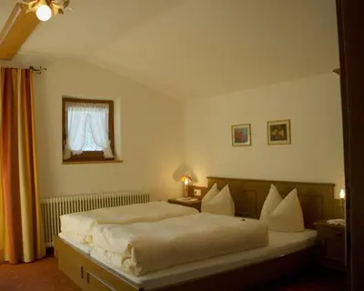 Ein Bett oder Betten in einem Zimmer der Unterkunft Gästehaus Elfriede