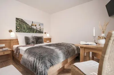 Ein Bett oder Betten in einem Zimmer der Unterkunft Restaurant Gästehaus Wiesenheim