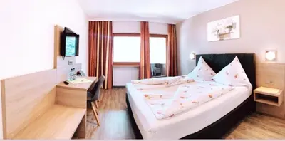 Ein Bett oder Betten in einem Zimmer der Unterkunft Hotel Sonnhof