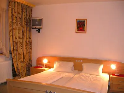 Ein Bett oder Betten in einem Zimmer der Unterkunft Hotel Sonnhof