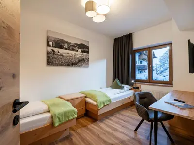 Ein Bett oder Betten in einem Zimmer der Unterkunft Brixentalerhof