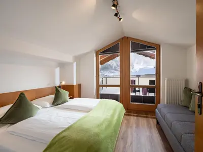 Ein Bett oder Betten in einem Zimmer der Unterkunft Brixentalerhof