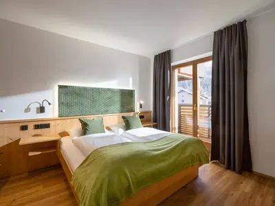 Ein Bett oder Betten in einem Zimmer der Unterkunft Brixentalerhof
