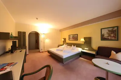 Ein Bett oder Betten in einem Zimmer der Unterkunft Hotel Lamark