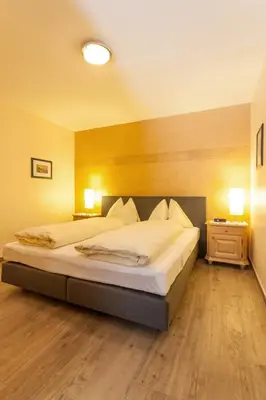 Ein Bett oder Betten in einem Zimmer der Unterkunft Amadeus Appartement