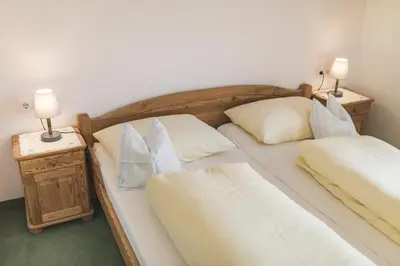 Ein Bett oder Betten in einem Zimmer der Unterkunft Haus Kristall