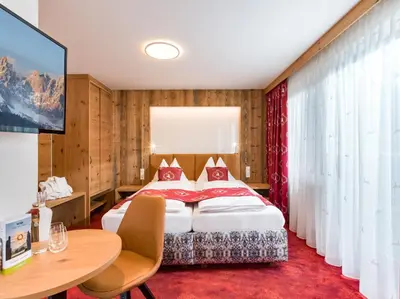 Ein Bett oder Betten in einem Zimmer der Unterkunft Hotel Feichter