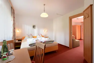 Ein Bett oder Betten in einem Zimmer der Unterkunft Hotel Feichter