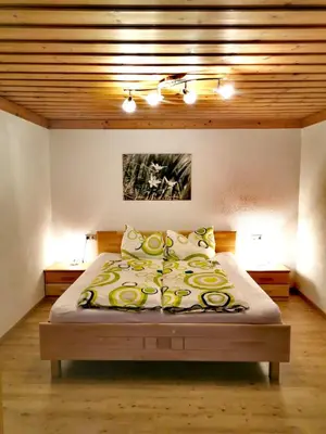 Ein Bett oder Betten in einem Zimmer der Unterkunft Ferienwohnungen Birkleiten