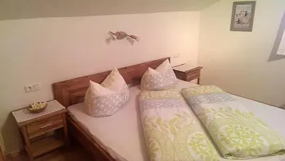 Ein Bett oder Betten in einem Zimmer der Unterkunft Apartment Greidlerhof