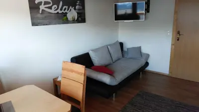 Ein Sitzbereich in der Unterkunft Apartment Greidlerhof