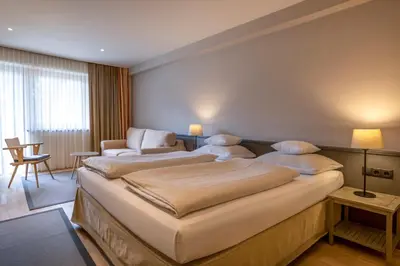 Ein Bett oder Betten in einem Zimmer der Unterkunft Hotel Edelweiss
