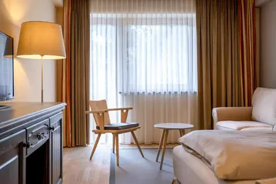 Ein Bett oder Betten in einem Zimmer der Unterkunft Hotel Edelweiss