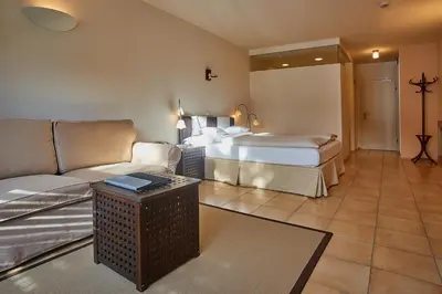 Ein Bett oder Betten in einem Zimmer der Unterkunft Hotel Edelweiss