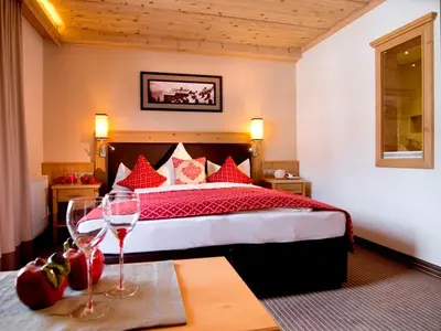 Ein Bett oder Betten in einem Zimmer der Unterkunft Hotel Bergkristall