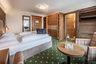 Ein Bett oder Betten in einem Zimmer der Unterkunft Naturhotel Alpenblick