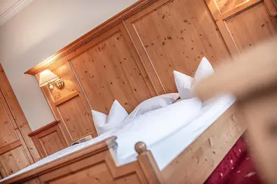 Ein Bett oder Betten in einem Zimmer der Unterkunft Naturhotel Alpenblick