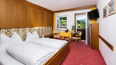 Ein Bett oder Betten in einem Zimmer der Unterkunft Traditionsgasthof Weißbacher