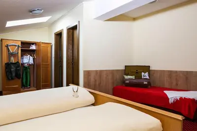 Ein Bett oder Betten in einem Zimmer der Unterkunft Traditionsgasthof Weißbacher