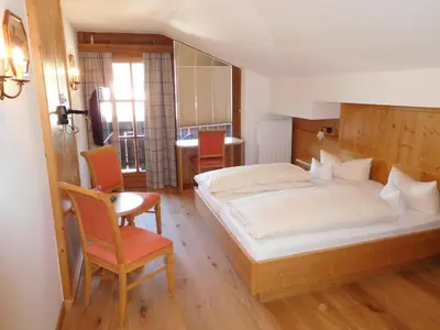 Ein Bett oder Betten in einem Zimmer der Unterkunft Hotel Kirchenwirt