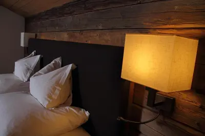 Ein Bett oder Betten in einem Zimmer der Unterkunft Hotel Kirchenwirt