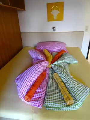 Ein Bett oder Betten in einem Zimmer der Unterkunft Apartement GYARMATY