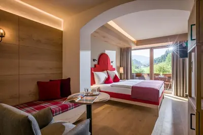 Ein Bett oder Betten in einem Zimmer der Unterkunft Hotel Haflingerhof