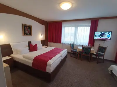 Ein Bett oder Betten in einem Zimmer der Unterkunft Gästehaus Burgi