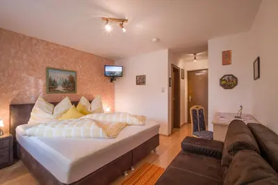 Ein Bett oder Betten in einem Zimmer der Unterkunft Gasthof Mairwirt