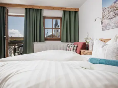 Ein Bett oder Betten in einem Zimmer der Unterkunft Kinderbauernhof Scharrerhof