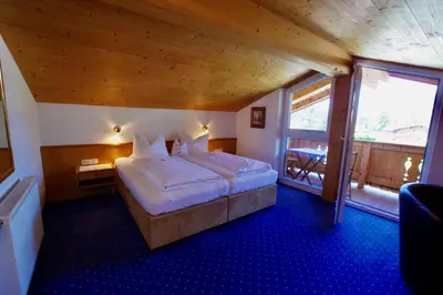 Ein Bett oder Betten in einem Zimmer der Unterkunft Hotel-Pension Heike