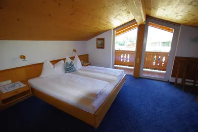 Ein Bett oder Betten in einem Zimmer der Unterkunft Hotel-Pension Heike