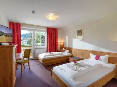 Ein Bett oder Betten in einem Zimmer der Unterkunft Hotel Harfenwirt #Ski-in Ski-out