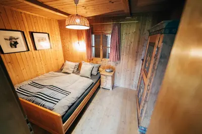 Ein Bett oder Betten in einem Zimmer der Unterkunft Zauberhuette Wildschoenau