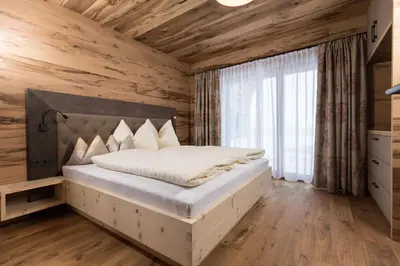 Ein Bett oder Betten in einem Zimmer der Unterkunft Stadl Lofts Plattenalm - Premiumchalets - Zillertal - Tirol - Salzburg
