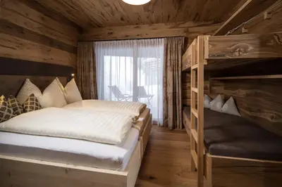 Ein Bett oder Betten in einem Zimmer der Unterkunft Stadl Lofts Plattenalm - Premiumchalets - Zillertal - Tirol - Salzburg