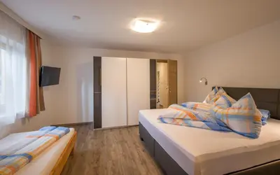 Ein Bett oder Betten in einem Zimmer der Unterkunft Ferienwohnung Lederer