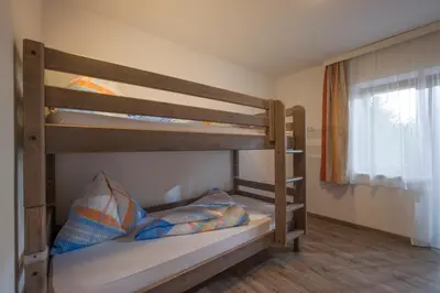 Ein Bett oder Betten in einem Zimmer der Unterkunft Ferienwohnung Lederer