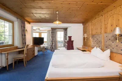 Ein Bett oder Betten in einem Zimmer der Unterkunft Hotel Silberberger - Wildschönau