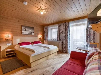 Ein Bett oder Betten in einem Zimmer der Unterkunft Pension Hinterholzer