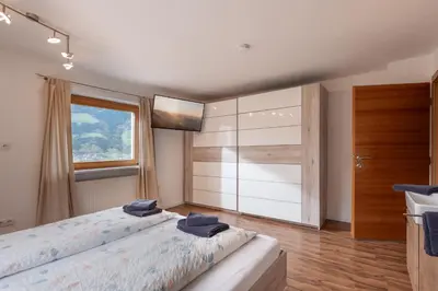 Ein Bett oder Betten in einem Zimmer der Unterkunft Apartments Gondelspaß