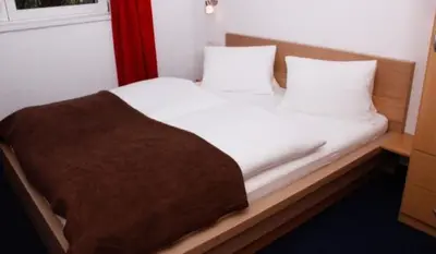 Ein Bett oder Betten in einem Zimmer der Unterkunft Apart Hannah